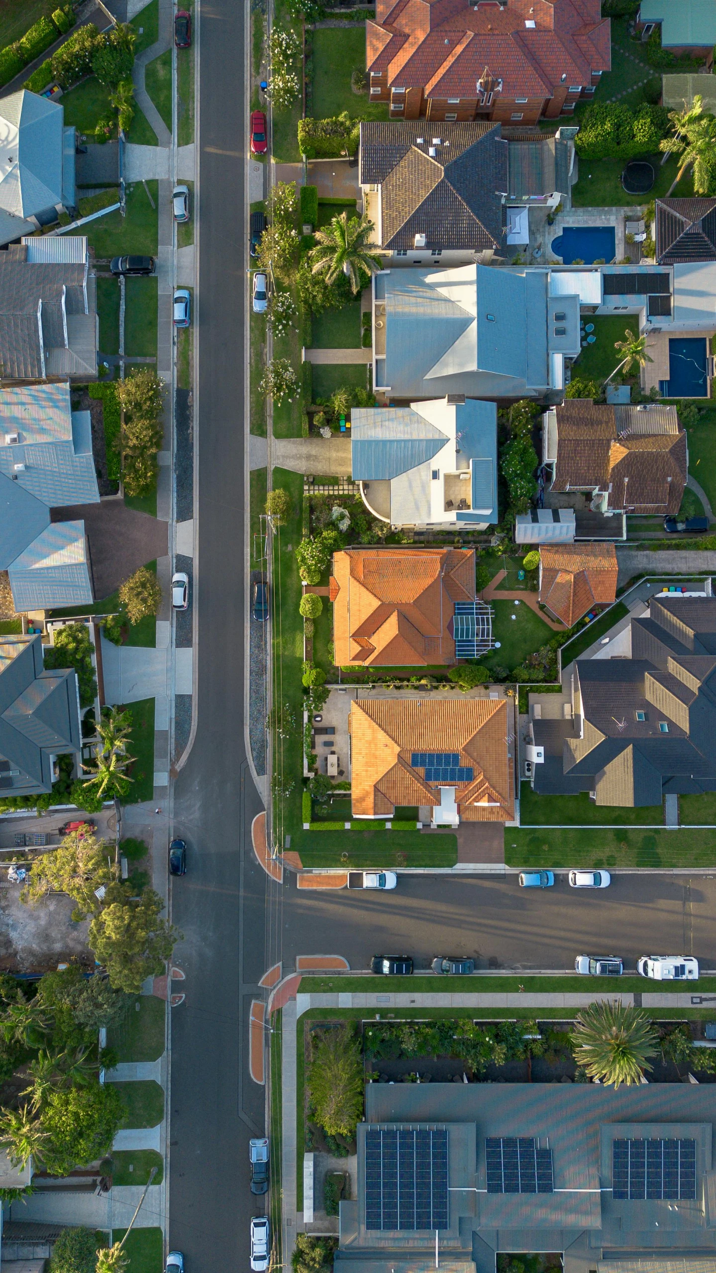 aerial view of houses near the intersection of two streets