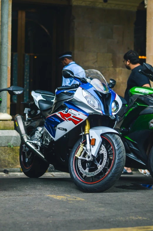 a motor bike parked next to another motorcycle