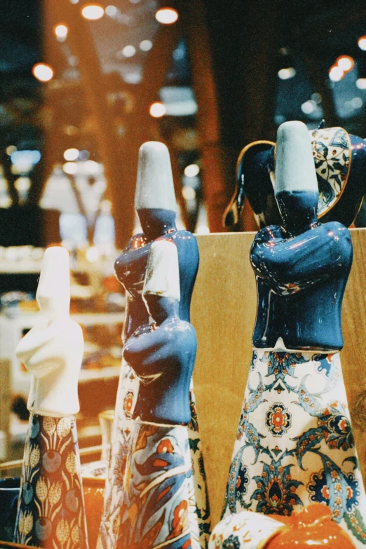 colorful ceramic figures in pots on display at a store