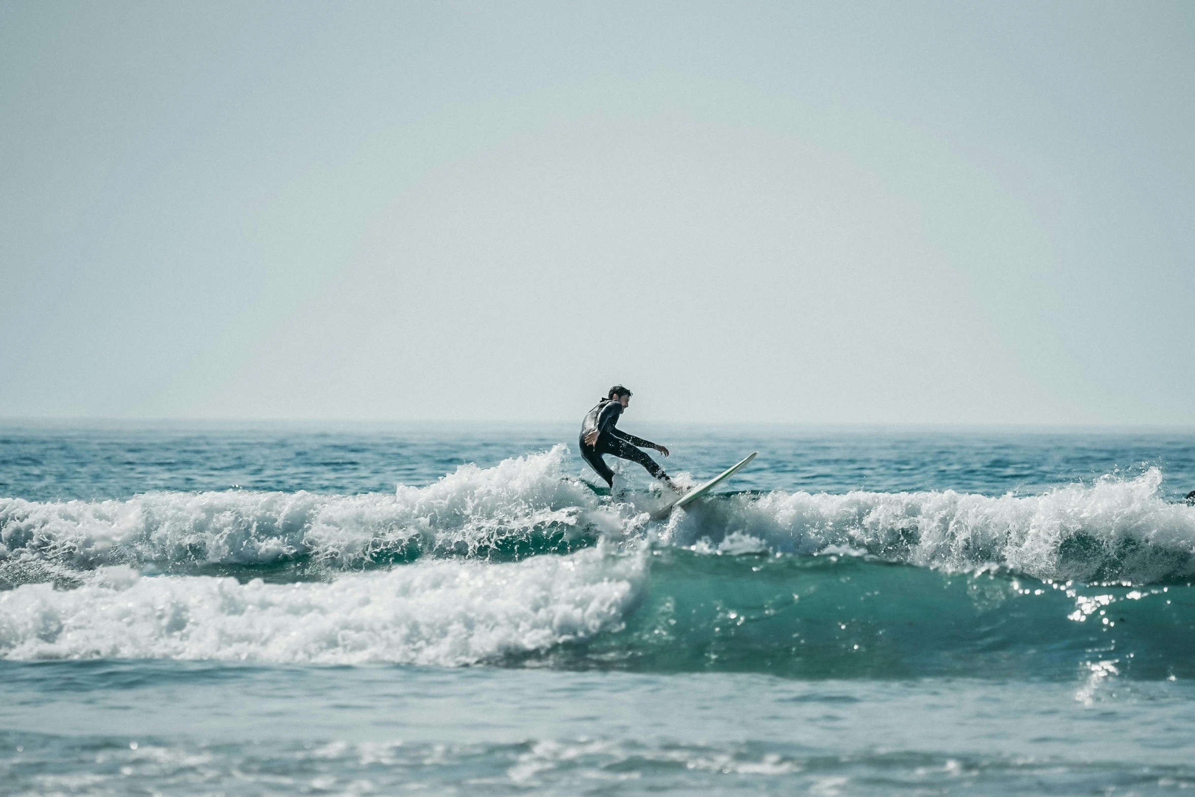 a surfer is riding the wave in the ocean