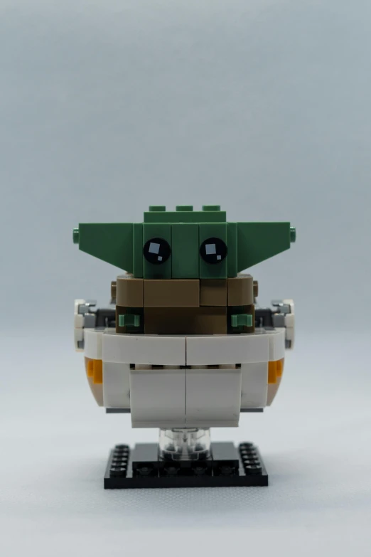 a toy made from lego bricks with a baby yoda face
