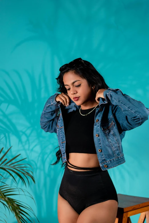 a woman in black lingerie, and jean jacket