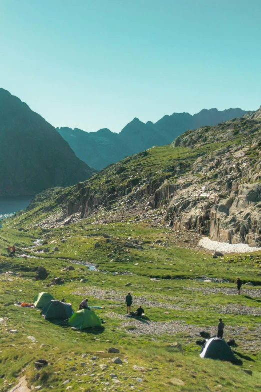 some tents in the middle of a valley