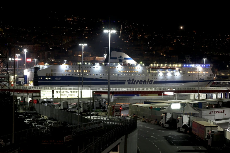 large boats are lined up on the docks by a dock