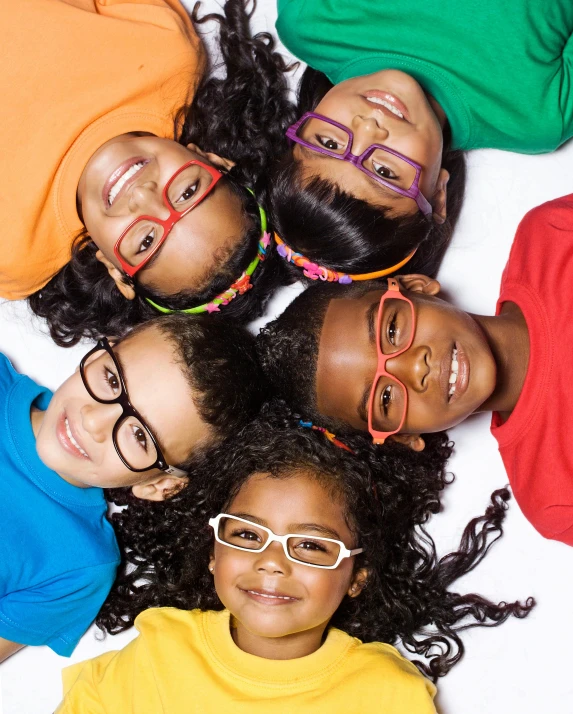 a group of children laying in a circle