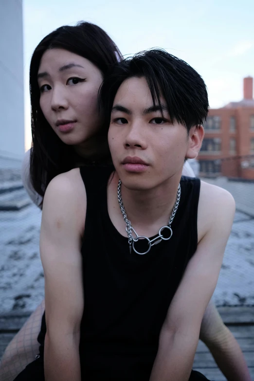 a man and a woman sitting on some steps