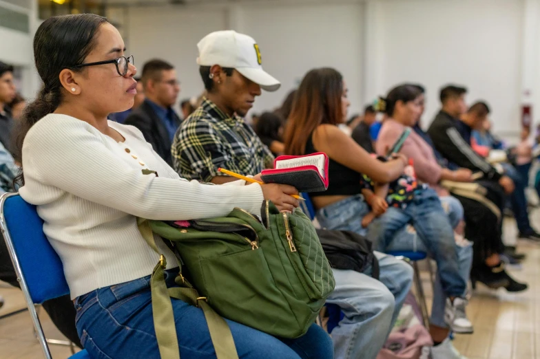 a group of people sitting in a waiting room