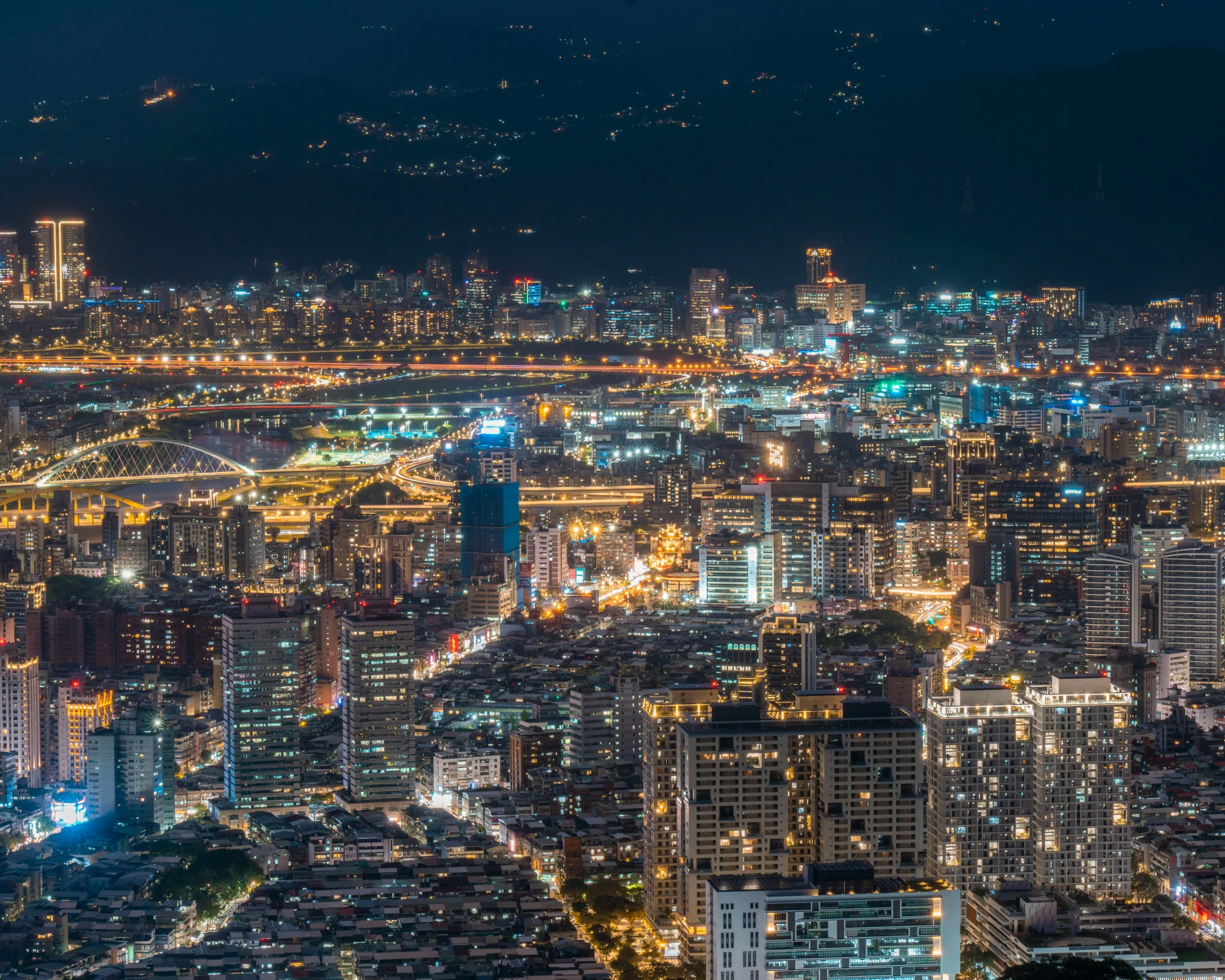 a picture of a night skyline with lights on