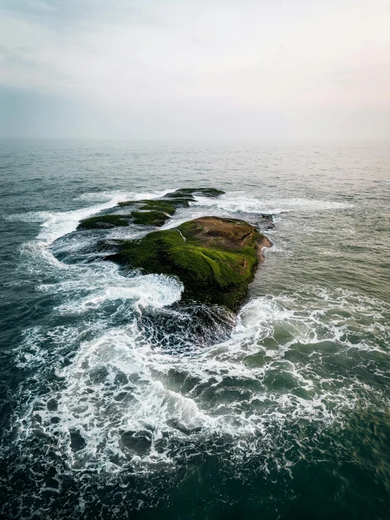 three island in the middle of the ocean