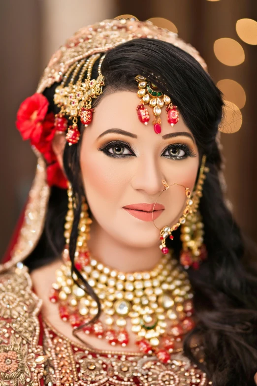 a beautiful asian bride dressed in gold