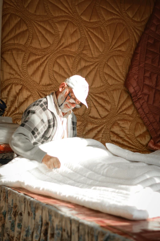 a man lays down on a bed next to another