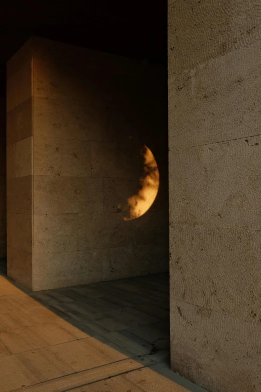 a close up of a building with a half moon above it