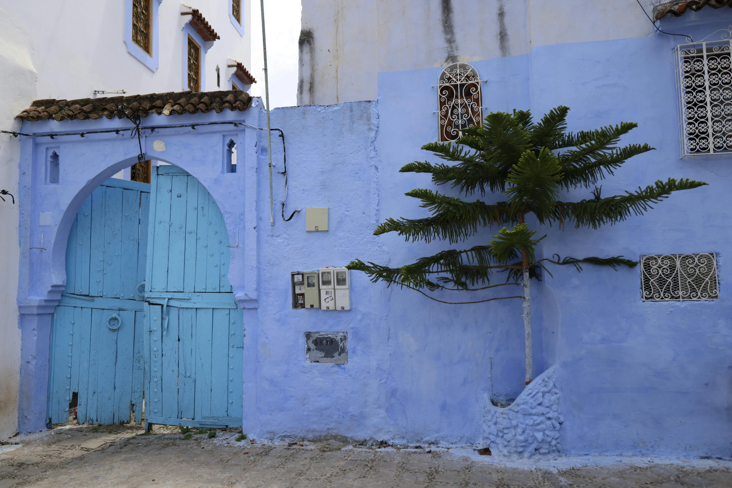 the blue painted walls of an old european style town