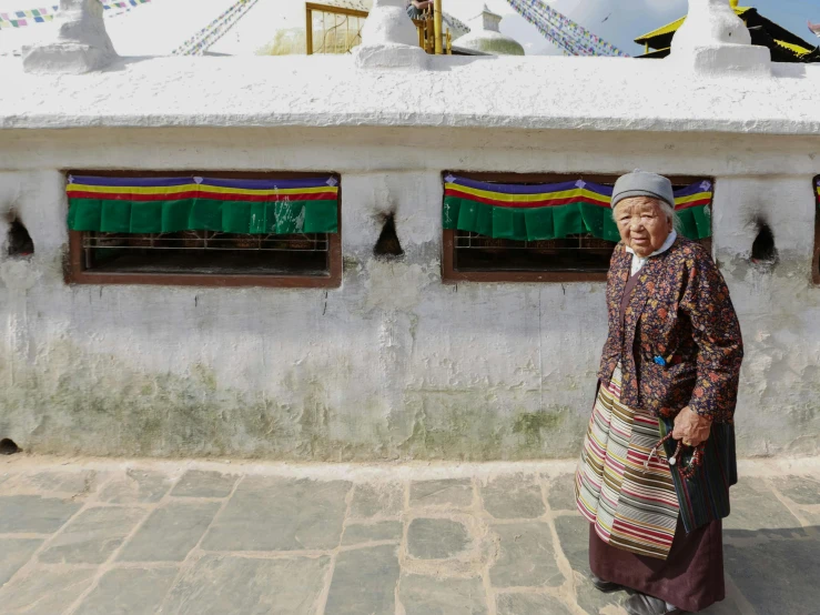 a person standing outside in front of a building