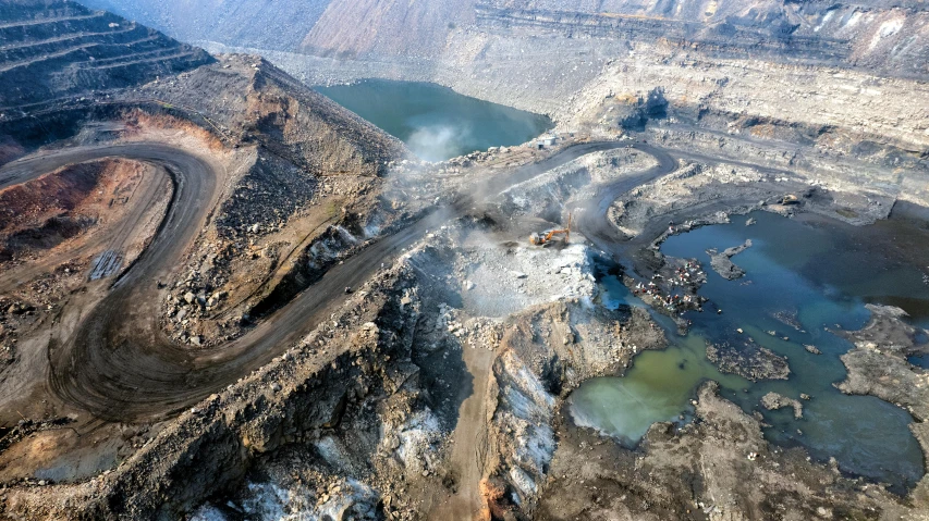 an open pit that is surrounded by dirt