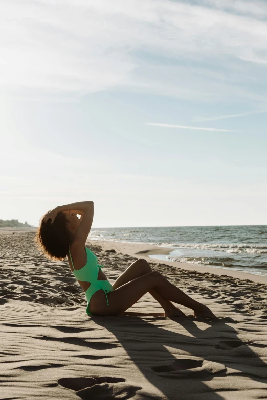 woman in a bikini on a beach posing for the camera