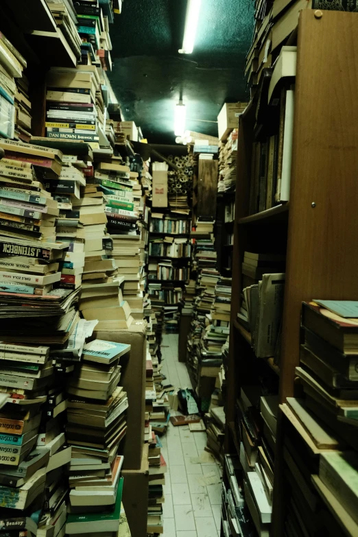 piles of books on display in large room