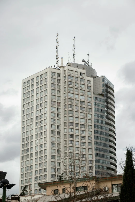tall white building with many windows on top