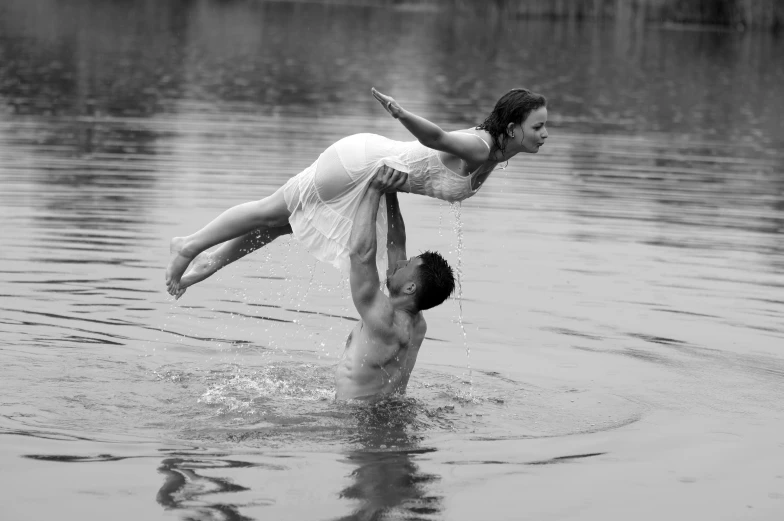 a man and woman are in the water