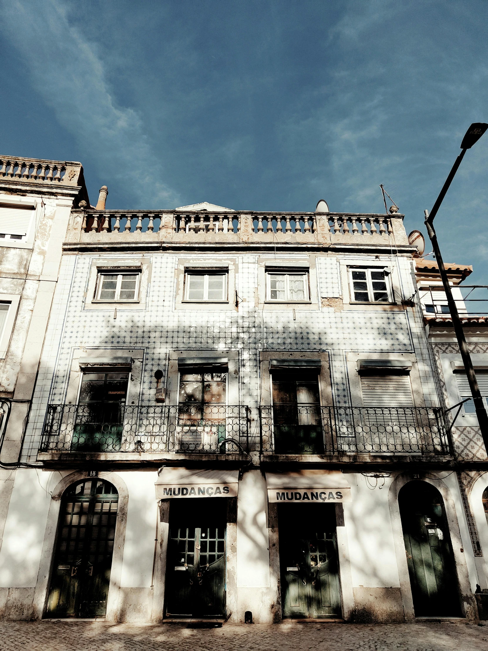 a building with balconies and balconies on the first story