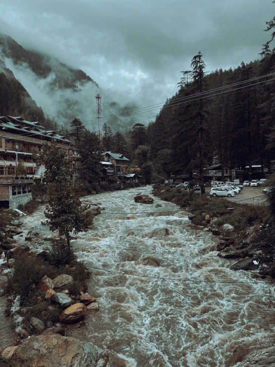 the river runs through the small town in the mountains
