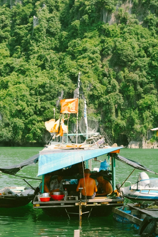 a small boat with a roof that is out on the water