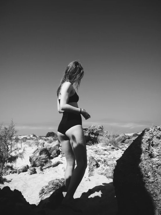 a woman with her  on some rocks