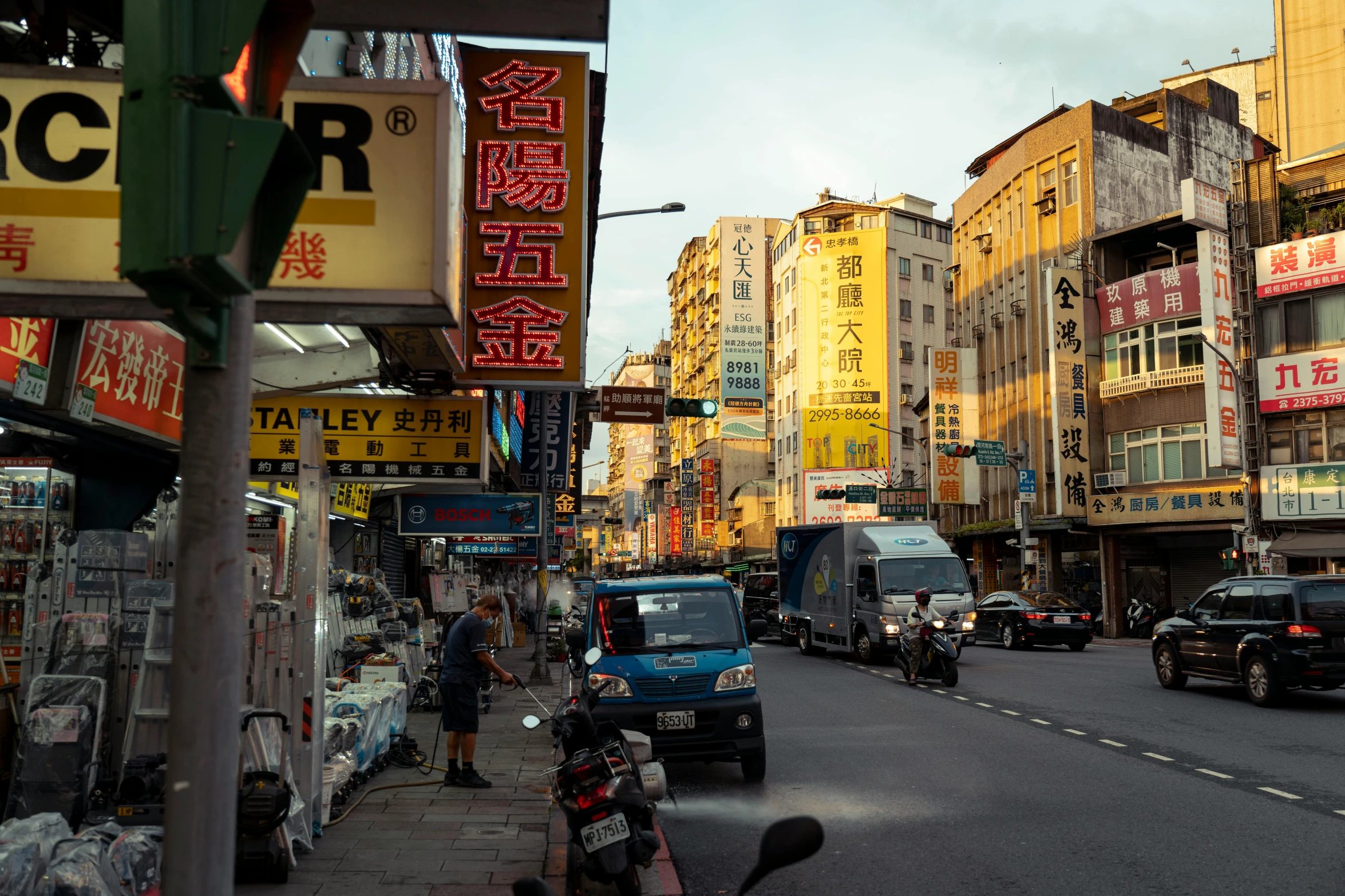 busy street filled with cars and pedestrians on it