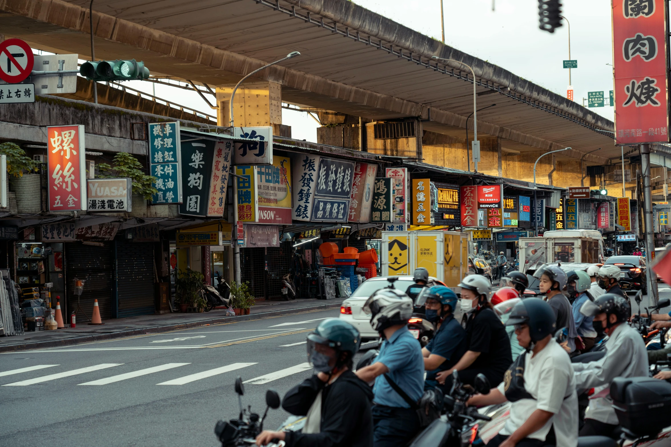 there are many motorcycles driving down this street