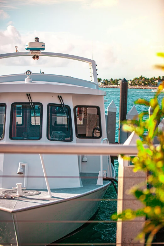 a large boat sitting at the dock with its doors open