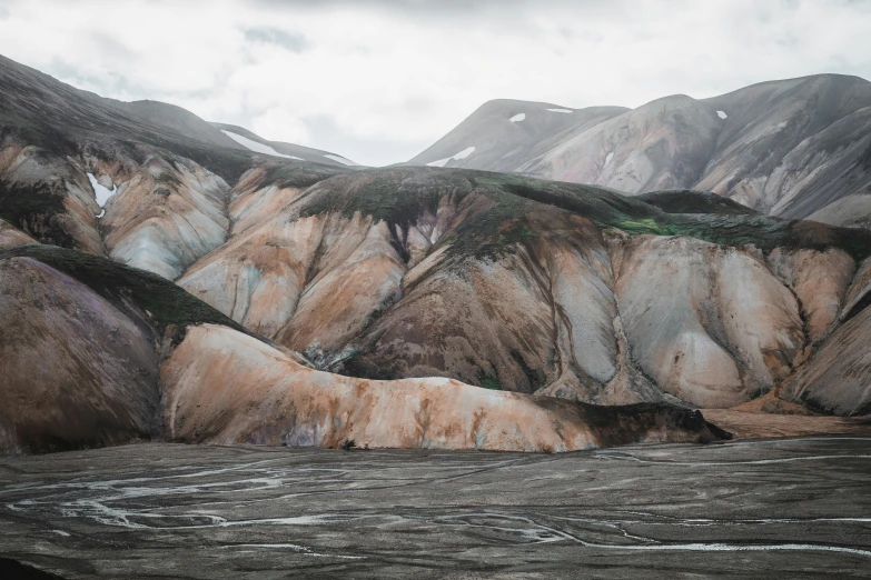 the mountains covered in colorful paint are standing side by side