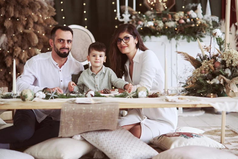 a couple and their child at the dinner table