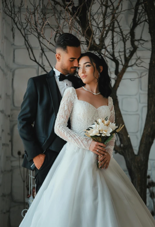 an asian couple is posing for a pograph at their wedding