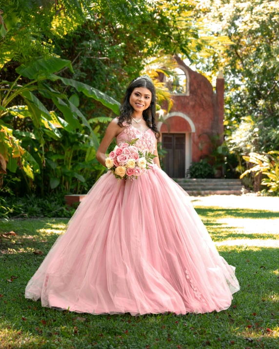 a  wearing a pink ball gown