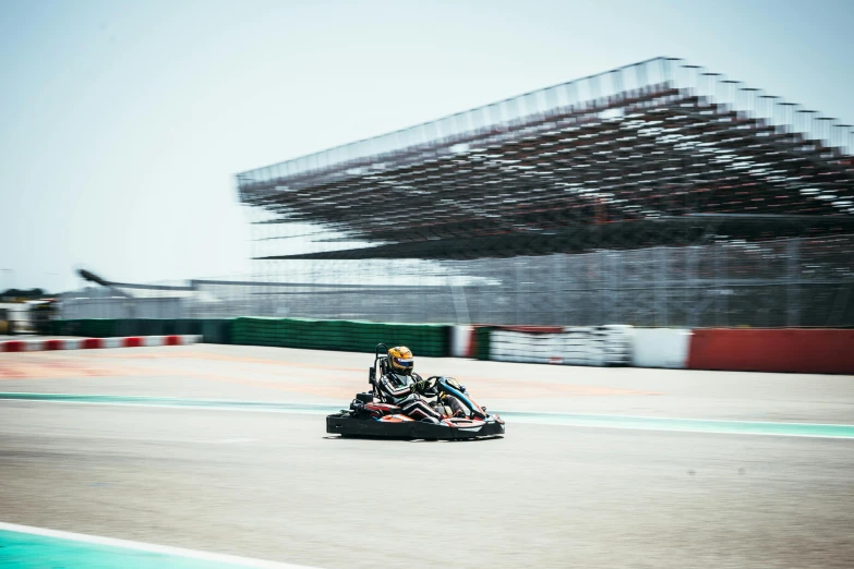 a man is driving a motorcycle around an outdoor track