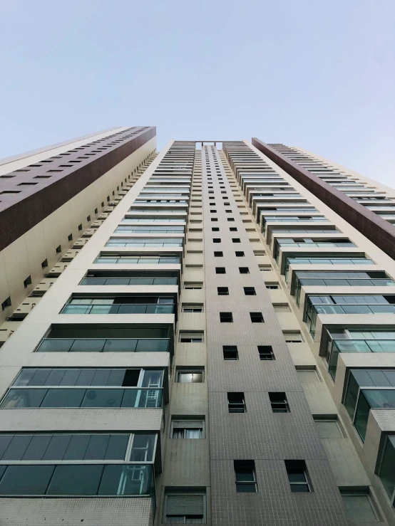 the side of a tall building with some windows on it