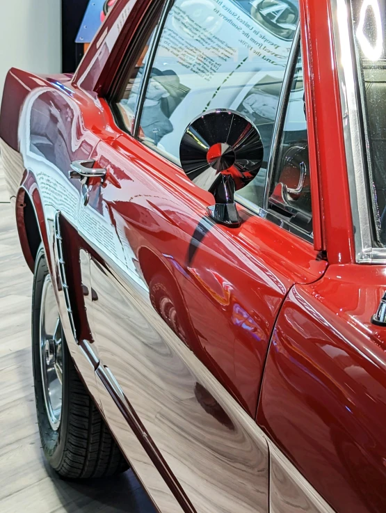 a red car with two fans on the roof