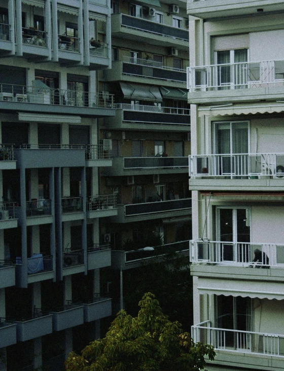 several balconies line the facade of buildings in a city