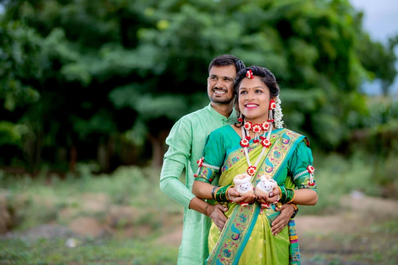 a man and a woman standing in a field