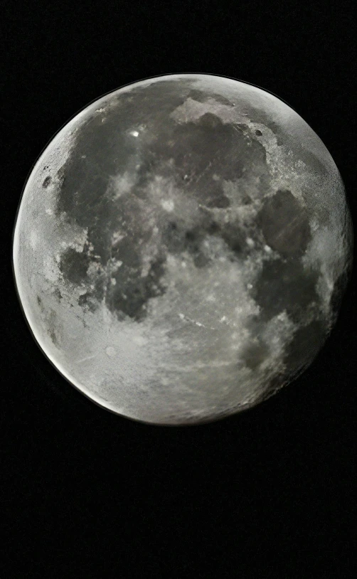 a large moon is shown in the sky with clouds