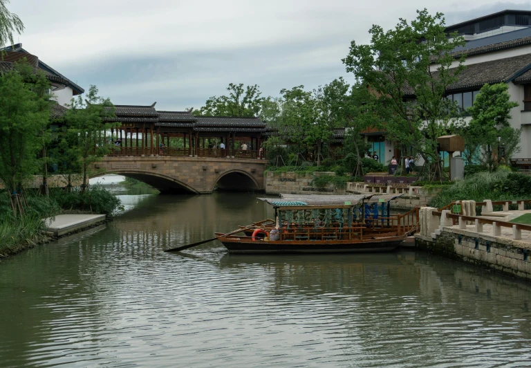 the boat travels on the river in the city