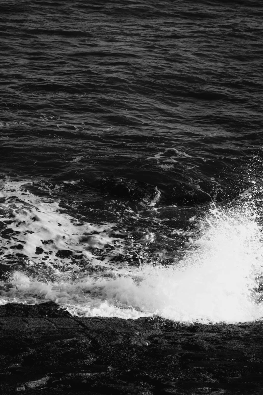 a man on a surf board, in the middle of waves