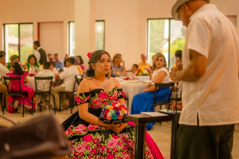 a woman in a colorful dress at a social gathering