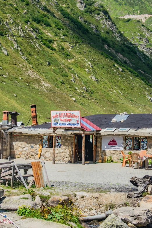 an open air shop is in the mountainside