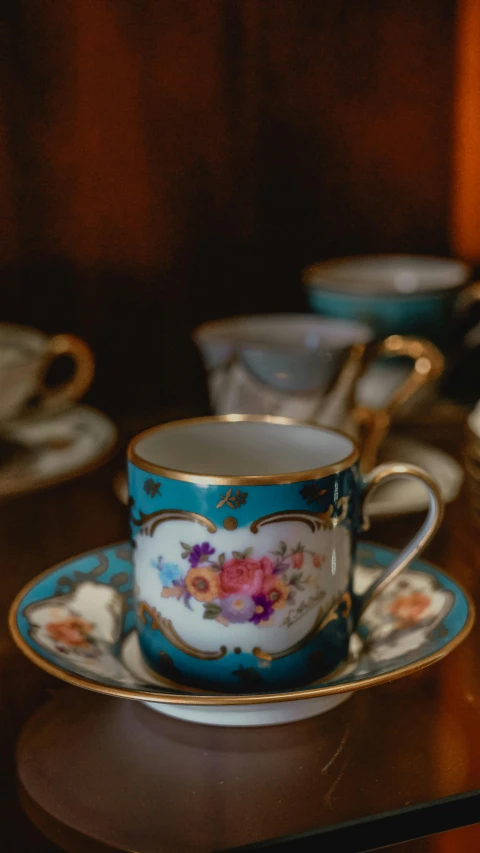 a group of pretty blue cups and saucers