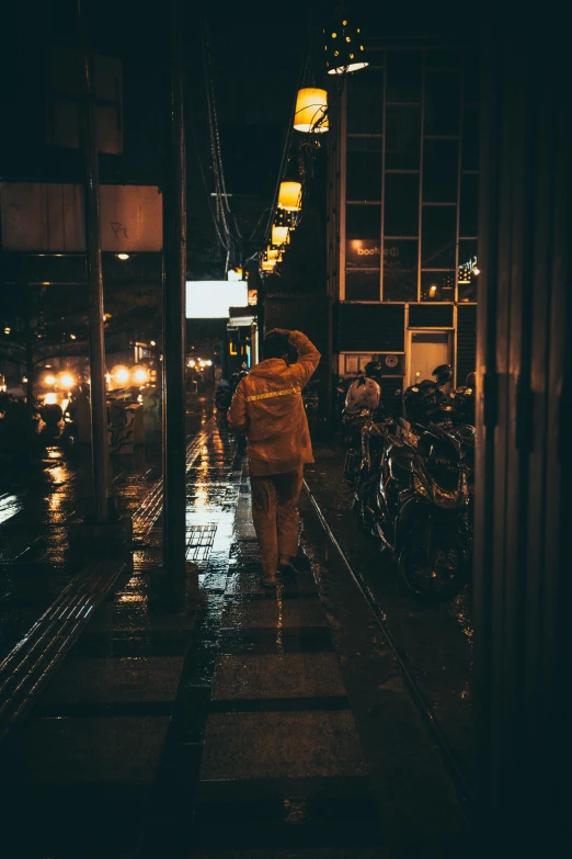 a person standing in the dark holding an umbrella