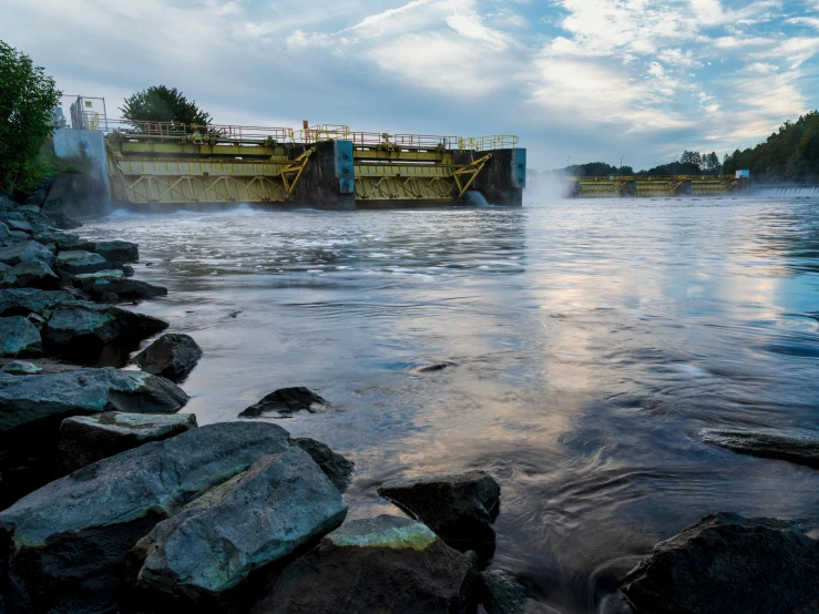 an old boat at dock near some rocks