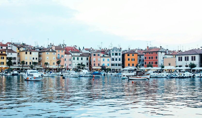 an island with many boats floating on top of it