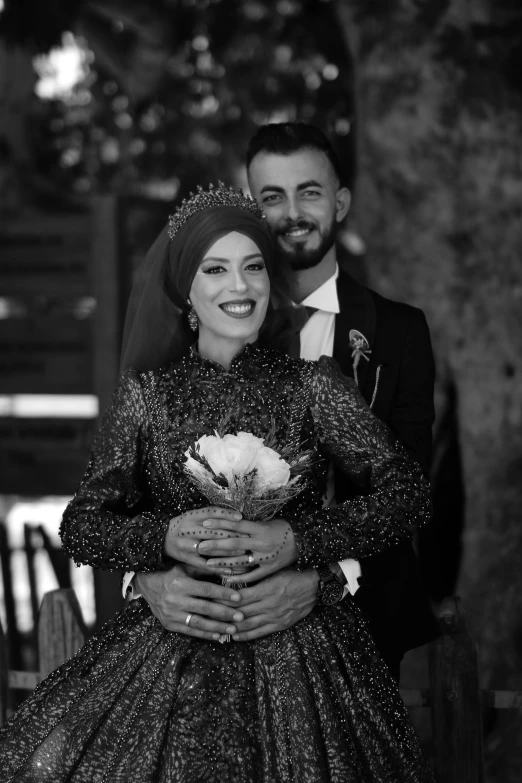 a bride hugging her groom under the gaze of their wedding day