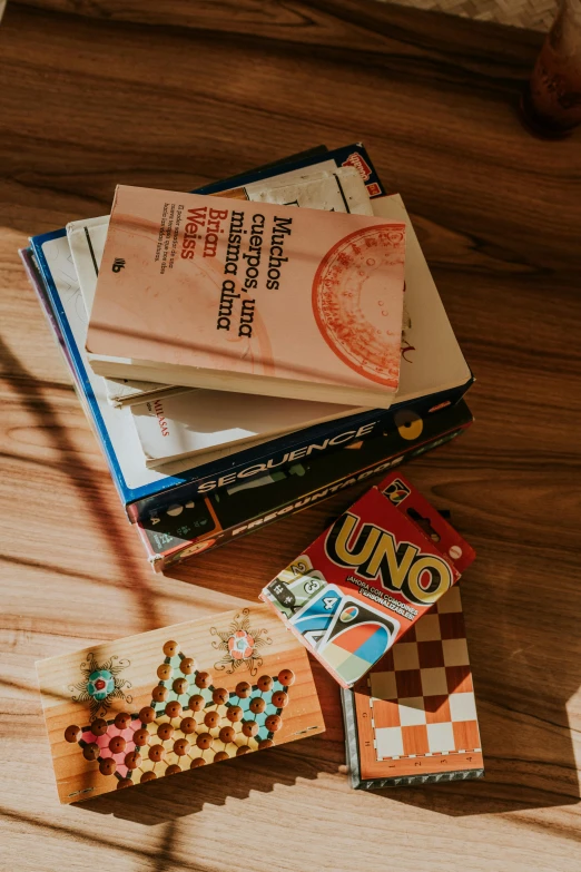 a bunch of books are piled on top of each other